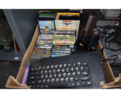 A Sinclair ZX Spectrum + Personel Computer with a Ingersoll Computer Program Data Recorder, Joystick and many games including