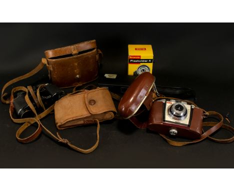 A Collection Of Camera Accessories including Kodak Coloursnap 35 camera, Kodak Film no.127, Boots 110 Teleflash, Brownie Flas
