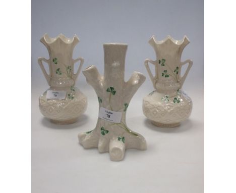 A Belleek spill vase modelled as a tree trunk, 17cm high, together with a pair of Belleek splill vases (3)  