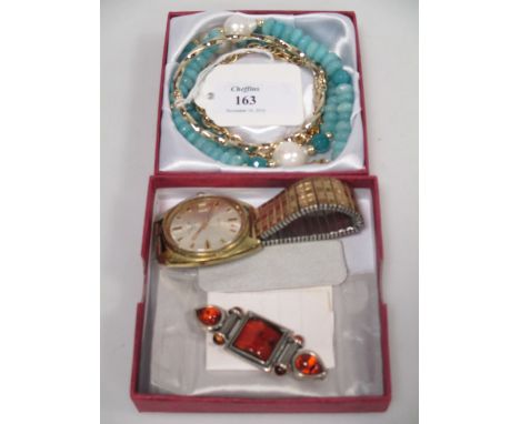 A 9ct fancy link bracelet set with a 9ct mounted turquoise heart (6.5g), an oval hinged bangle stamped '375' (3.7g), a blue s
