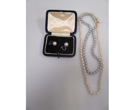 A pearl necklace with a 9ct pearl cluster clasp, 49cm long, a pale grey pearl necklace, 39cm long and a pair of 1cm diameter 