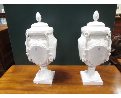 A pair of Paris (Jacob Petit) white porcelain vases and covers, circa 1850, marked 'JP' in blue, one foot cracked, and one fi