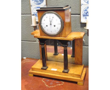 A pine cased mantle clock, 43cm high and a wall/overmantle mirror, 69 x 43cm (2)  