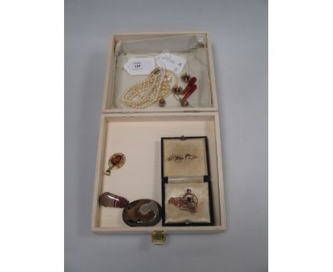 A quantity of jewellery to include an amethyst and seed pearl pendant, a graduated pearl necklace with bright cut engraved cl