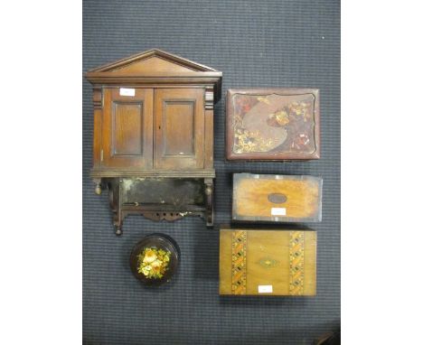 A 19th century satin wood and crossbanded tea caddy, together with three other boxes and a wall cabinet (5)  