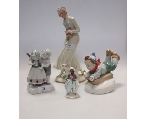 A Goebel figure group of two children, a Pirken Hammer figure of a lady, a Vienna porcelain figure of a boy and another (4)  