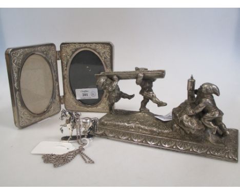 A plated table lighter modelled with gnomes, a plated double photo frame and a white metal model of a horse, stamped 835 to s