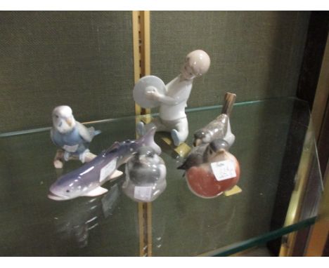 A collection of Copenhagen animal figures and a LLadro figure of a seated child  