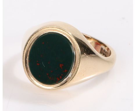 9 carat gold ring, with plain oval bloodstone panel to the head, ring size W, 11.3g