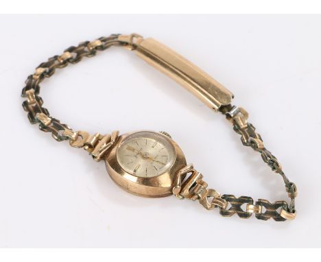 Accurist 9 carat gold ladies wristwatch, the signed silver dial with baton markers, manual wound, on a gold coloured metal br