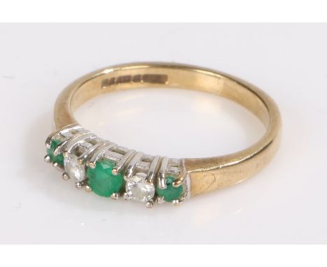 9 carat gold ring set with three emeralds and two pieces of clear paste, ring size J1/2, 1.9g