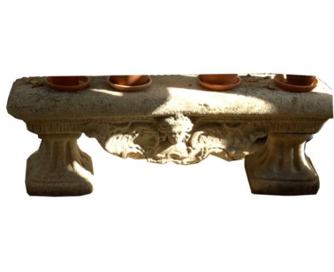 Gartenbank. Stein. Sitzfläche lose auf 2 säulenförmigen Untergestellen. Witterungsspuren. Unbestimmtes Alter. Ca. 50x 145x 36