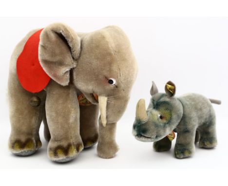 Stehender Elefant und Nashorn "Nosy", Steiff. Nashorn mit Knopf und Fahne, beide mit Schiild. Nahezu unbespielt. 50er/60er Ja