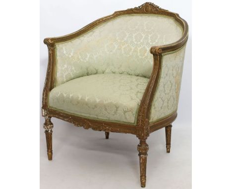 Fauteuil im Stil Louis XVI. Geschnitztes Holzgestell mit Restvergoldung. Seidenpolsterung. Gebrauchsspuren. 1. Hälfte 20. Jh.