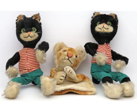 2 "Bigo-Bello"-Kater, Schuco und Handpuppe "Löwe", Steiff. L. bespielt. 20. Jh. Kater L. ca. 33 cm, Löwe L. 23 cm. 