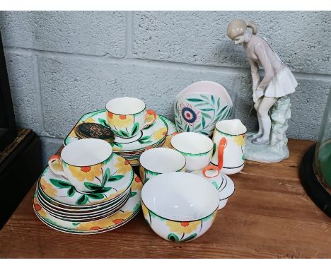 A Lladro figure of a female golfer together with a Poole pottery vase and an Ivoryware Hancocks hand painted part tea service
