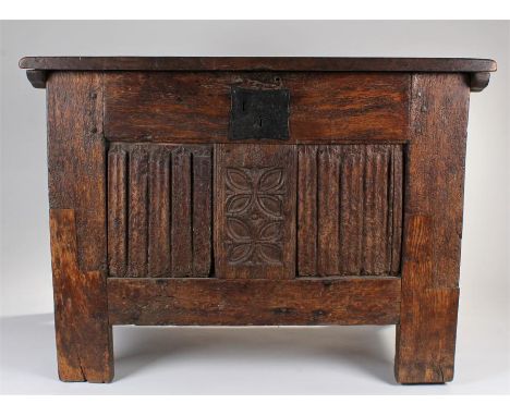 16th Century and later oak coffer, circa 1540, the later hinged rectangular top enclosing storage space, panel sides, with a 