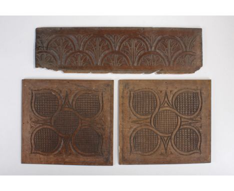 Three 17th Century carved oak panels, to include a pair of panels carved as a stylized flower, 31cm wide, together with a lea
