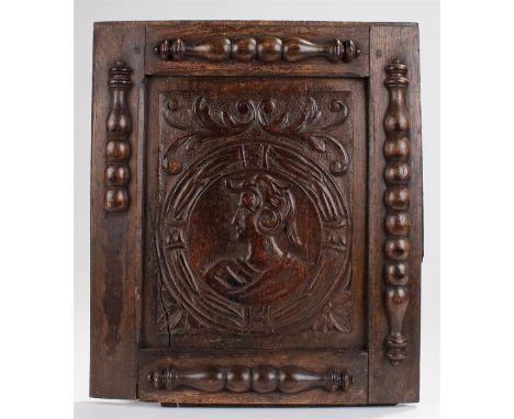 18th Century oak Romayne panel, carved with a central figure, swag edge and applied half spindles, 40cm x 46cm