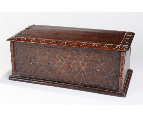 Oak candle box made from late 17th Century timbers. The hinged top with carved edge, above a flower and diamond carved front 