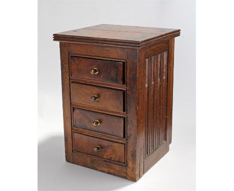 Miniature oak chest incorporating 17th Century panels. The rectangular top above a bank of four drawers, either side with car