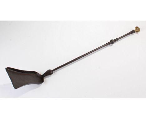 Early 19th Century steel and brass shovel, of small proportions, the brass finial above a turned shaft ad shovel end, 66cm lo
