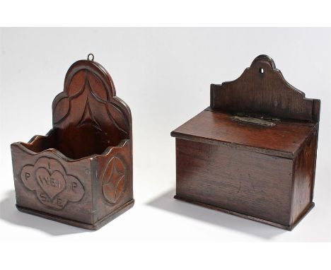 19th Century oak hanging candle box, the arched top with a hinged lid above panel front, sides and base, 23.5cm wide, togethe