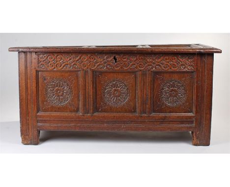 17th Century English oak coffer, circa 1640, the triple panelled top enclosing storage space and a candle box, panel sides, t