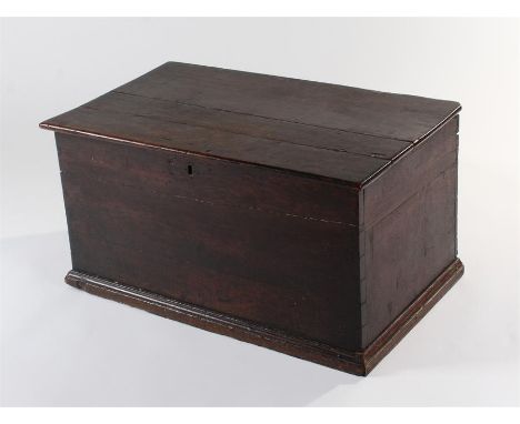 George III oak blanket box, the rectangular hinged top enclosing storage space, panel sides and front with a stepped plinth b