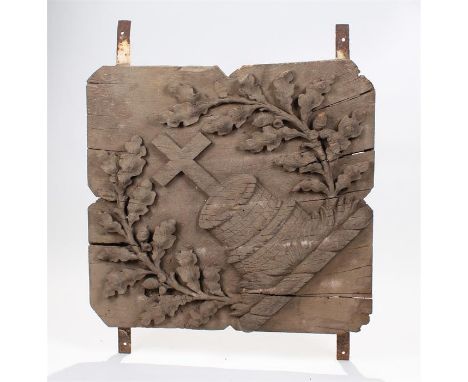 Large 18th Century armorial panel, depicting a cross above a well flanked by oak leaves, 64cm high