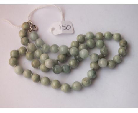 A string of jade beads with silver clasp 50g inc    