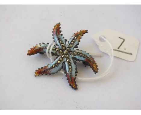 A silver marcasite and enamel star fish     