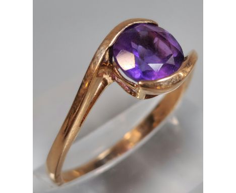 9ct rose gold and purple stone dress ring. 2.8g approx. Size R.  (B.P. 21% + VAT)