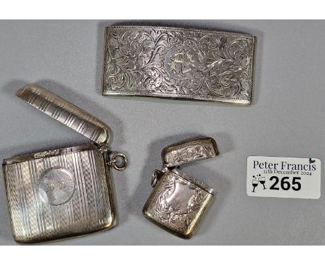 Two silver engraved and engine turned vesta cases. Birmingham 1902 and Chester 1909. Together with a Victorian silver engrave