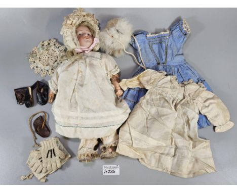 Early 20th century Simon and Halbig - Kammer and Reinhardt bisque character doll in original clothing with various accessorie