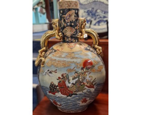 Large late 20th century Chinese moon flask, having gilded dragon handles above figures with clouds, fish and heron. 93cm high