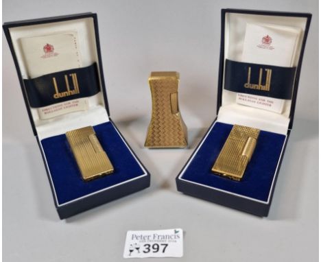 Dunhill pyramid shaped gilt finished table lighter, Classic Dunhill fluted gilt cigarette lighter in original box and another