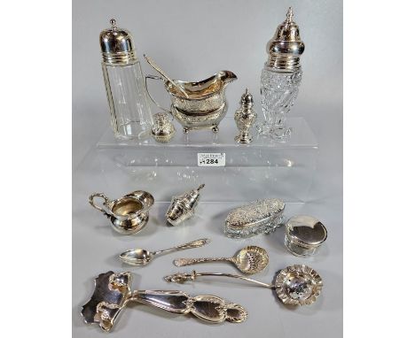 Shoe box of silver and silver plated items to include: spoons, ladles, sugar sifters, cream jugs, vanity dressing table items