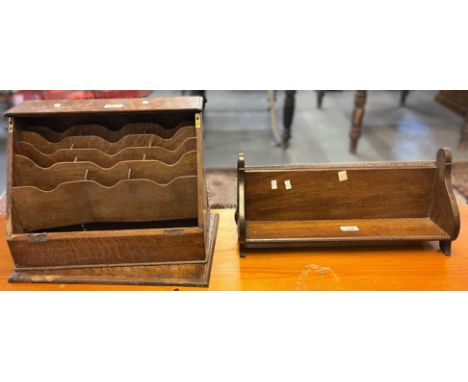 Early 20th century oak book trough, together with an oak slope front stationary cabinet. (2) (B.P. 21% + VAT)