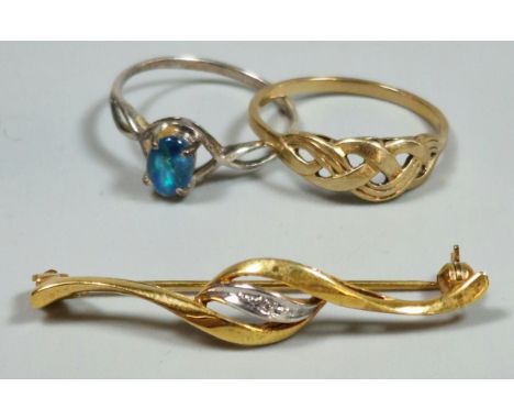 9ct gold and diamond bar brooch. 2.6g approx. together with a yellow metal Celtic/weave design dress ring. 1.6g approx. And a