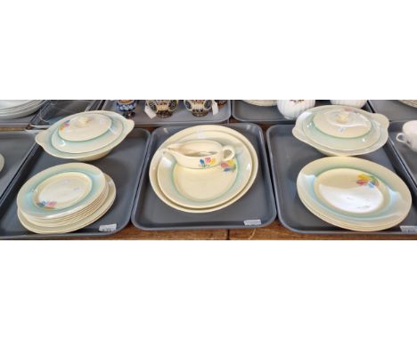 Three trays of Art Deco Newport Pottery, by Clarice Cliff, 'Crocus' design dinner ware to include: lidded tureens, oval meat 