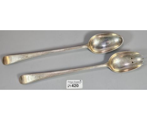 18th century silver serving spoon and salad serving spoon, both with engraved crests. London hallmarks. 6.4 troy oz approx. (
