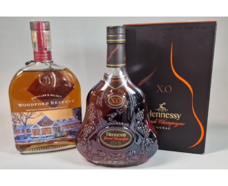 Bottle of Woodford Reserve Kentucky Straight Bourbon Whiskey, 70cl. Together with a bottle of Hennessy X O Grande Champagne C