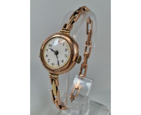 9ct gold ladies bracelet wristwatch, with circular enamel face. 16.8g approx. (B.P. 21% + VAT)