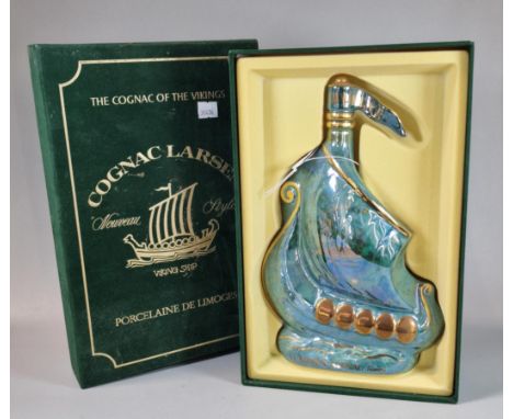 Bottle of Limoges Larsen Cognac, contained in a Viking ship porcelain decanter marked 'Invincible', in original presentation 