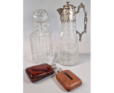 Late 19th century silver plated conical Claret jug , decorated with relief flowers and foliage and etched lattice foliate des