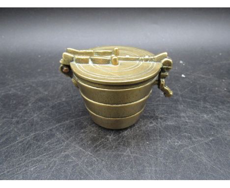 Brass graduating bell weights in caddy
