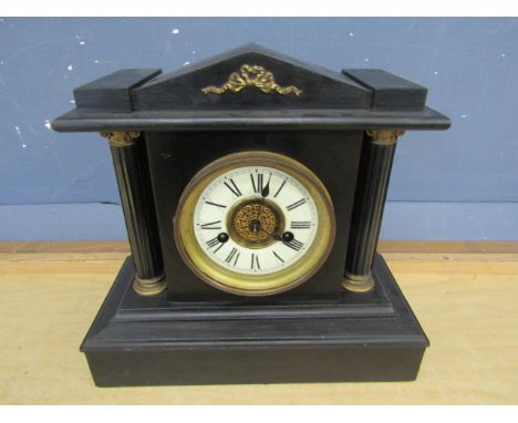 A wooden H.A.C mantle clock with enamel face, pendulum and key