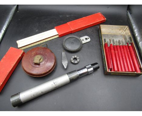 Greenkat telescope, 1953 leather tape measure, tech rule, wood carving tools, lead weights