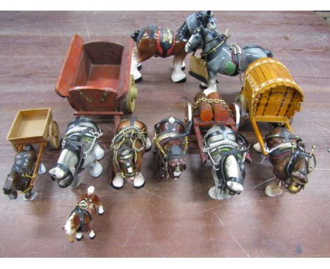 9 ceramic shire horse figurines, some with carts, one with wagon&nbsp;